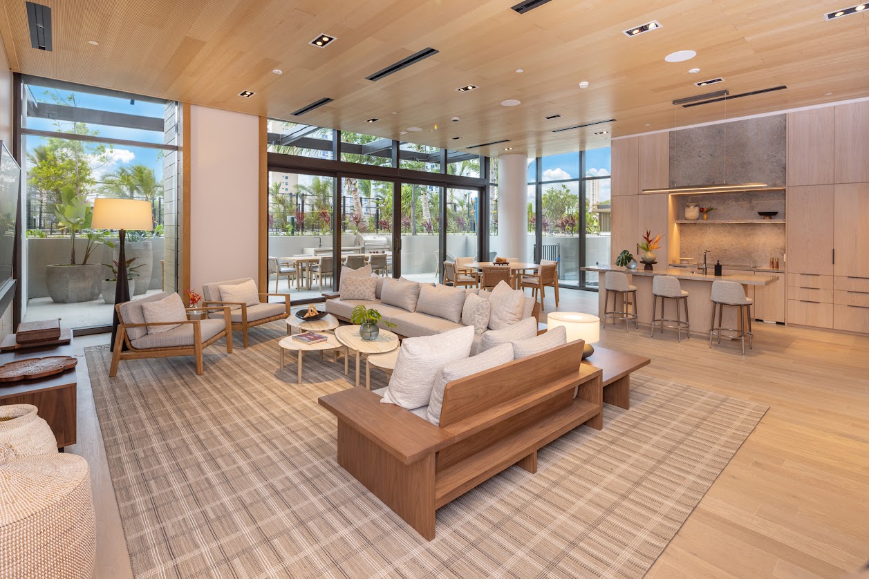 A modern living room with a large sectional sofa and a coffee table.